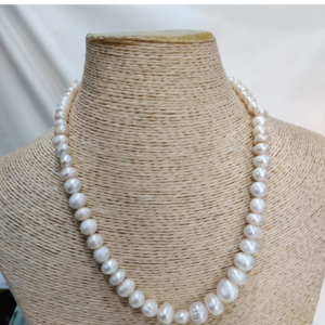 Freshwater pearl mala necklace with single strand of natural white pearls displayed on mannequin