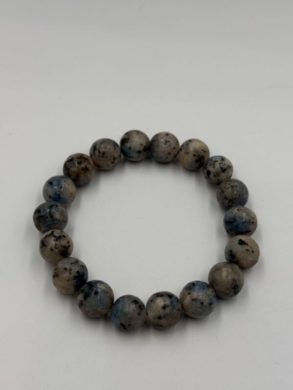 tiger eye bracelet with 8mm polished beads in shades of gold, brown and black.